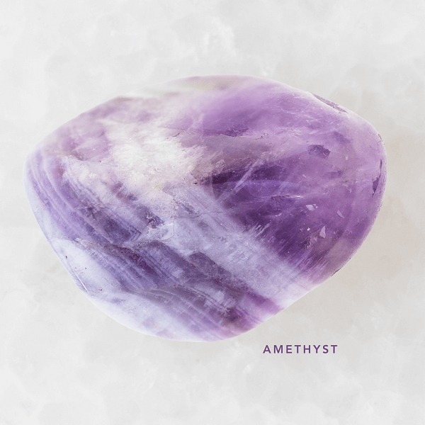 Image of the gemstone amethyst, the February birthstone.