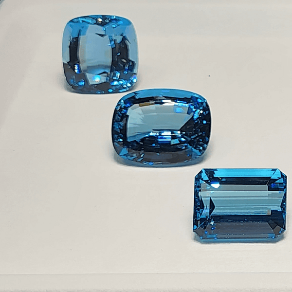 An image of various aquamarine gemstones that symbolize calm, clarity, and protection.