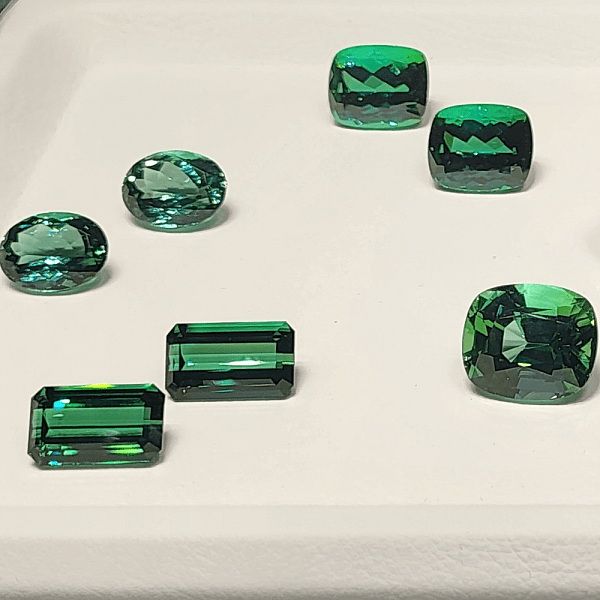 An image of various emerald gemstones that symbolize prosperity and new beginnings.