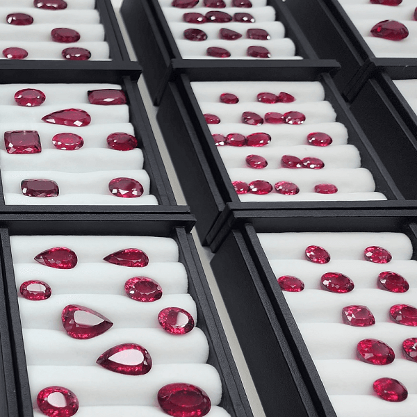 An image of various ruby gemstones that symbolize romance and enduring affection.