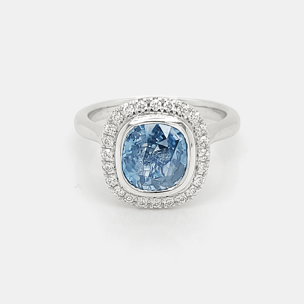 An image of a solitaire ring with an aquamarine stone.