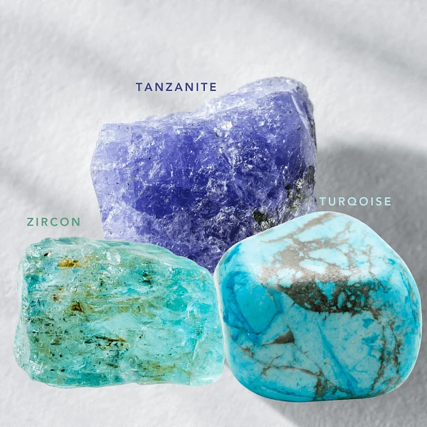Image of the gemstones Turqoise, Tanzanite and Zircon, the December birthstones.
