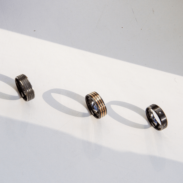 An image showcasing a selection of men’s engagement rings.