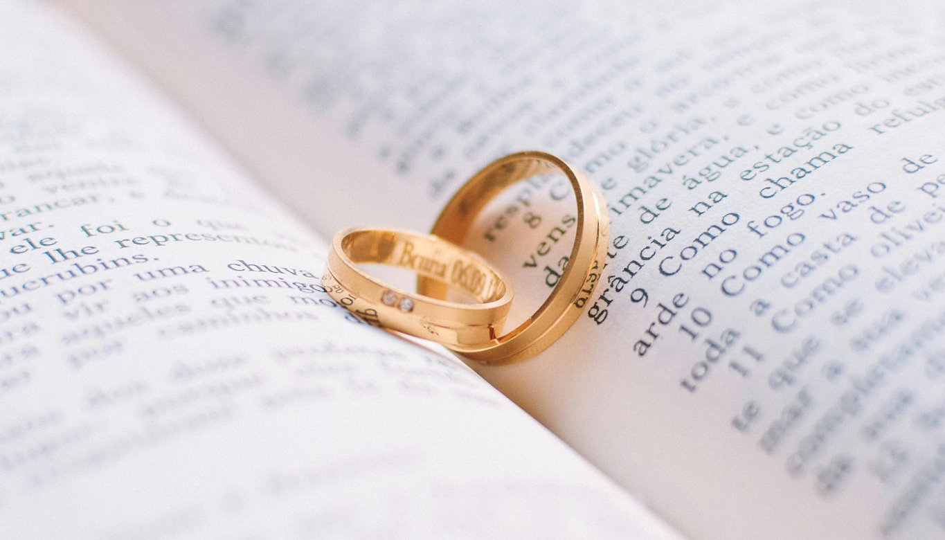 A close-up photo of engraved wedding rings