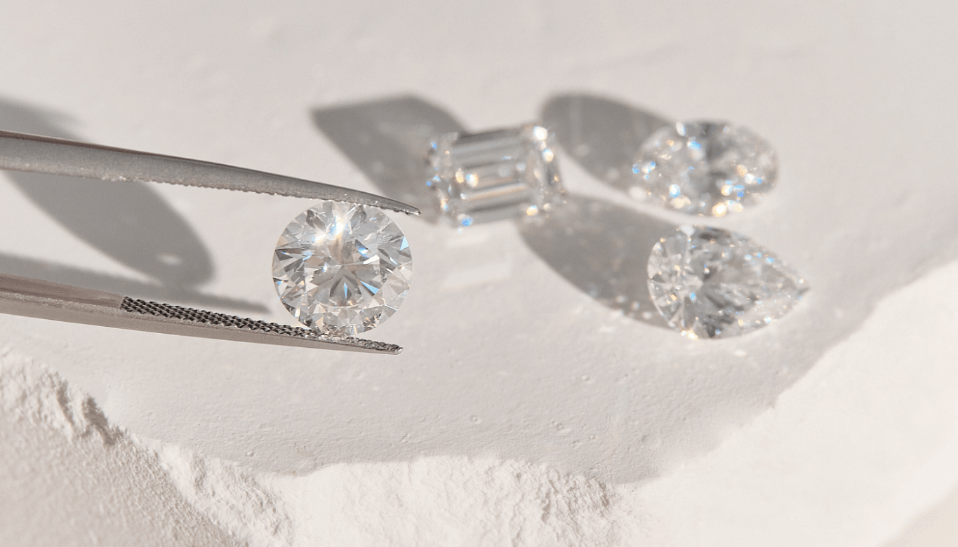Close-up of loose diamonds in various cuts, for an article about ethically sourced, conflict-free and sustainable diamonds.